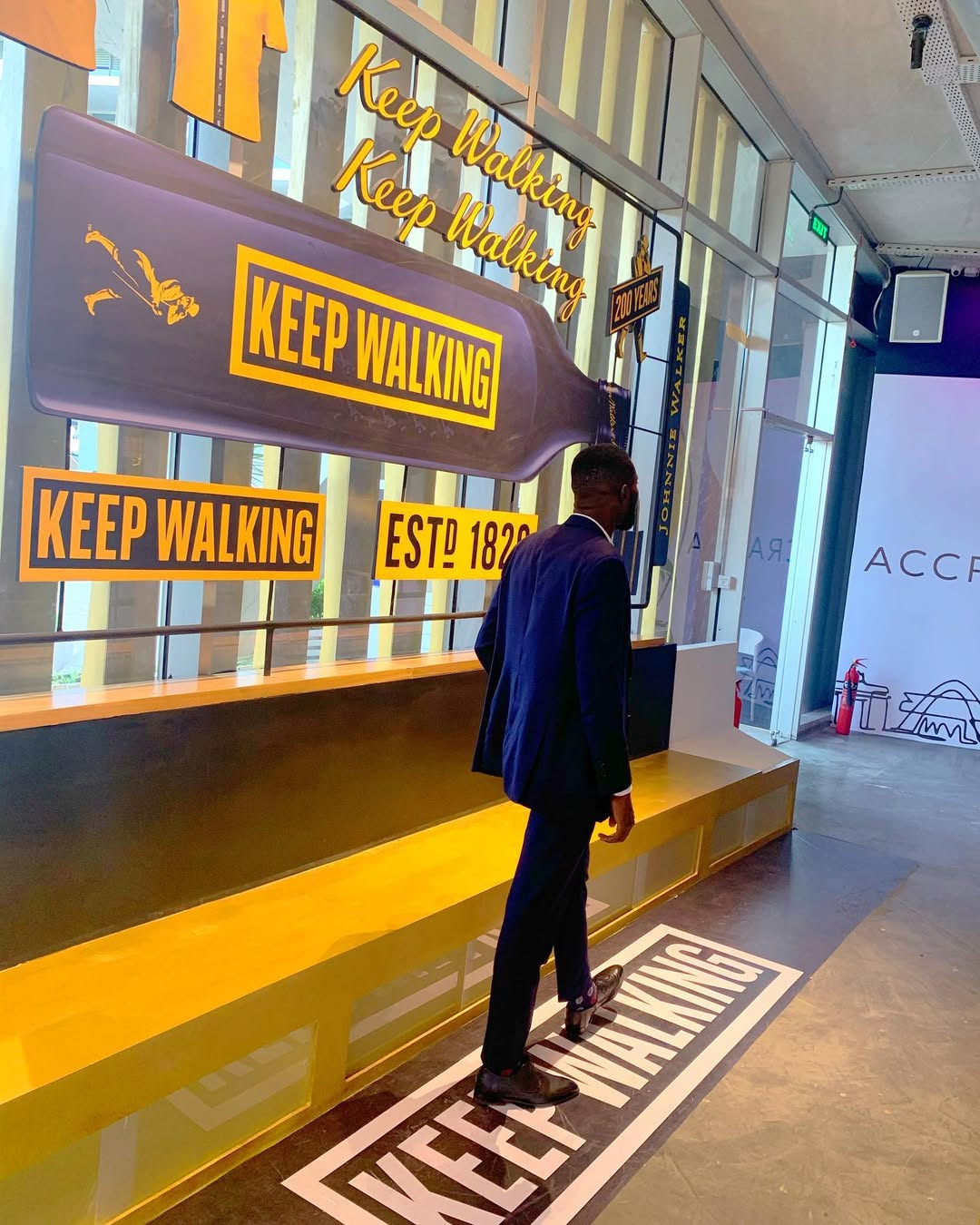 House of Walker Accra curved platform — side angle showing full scale