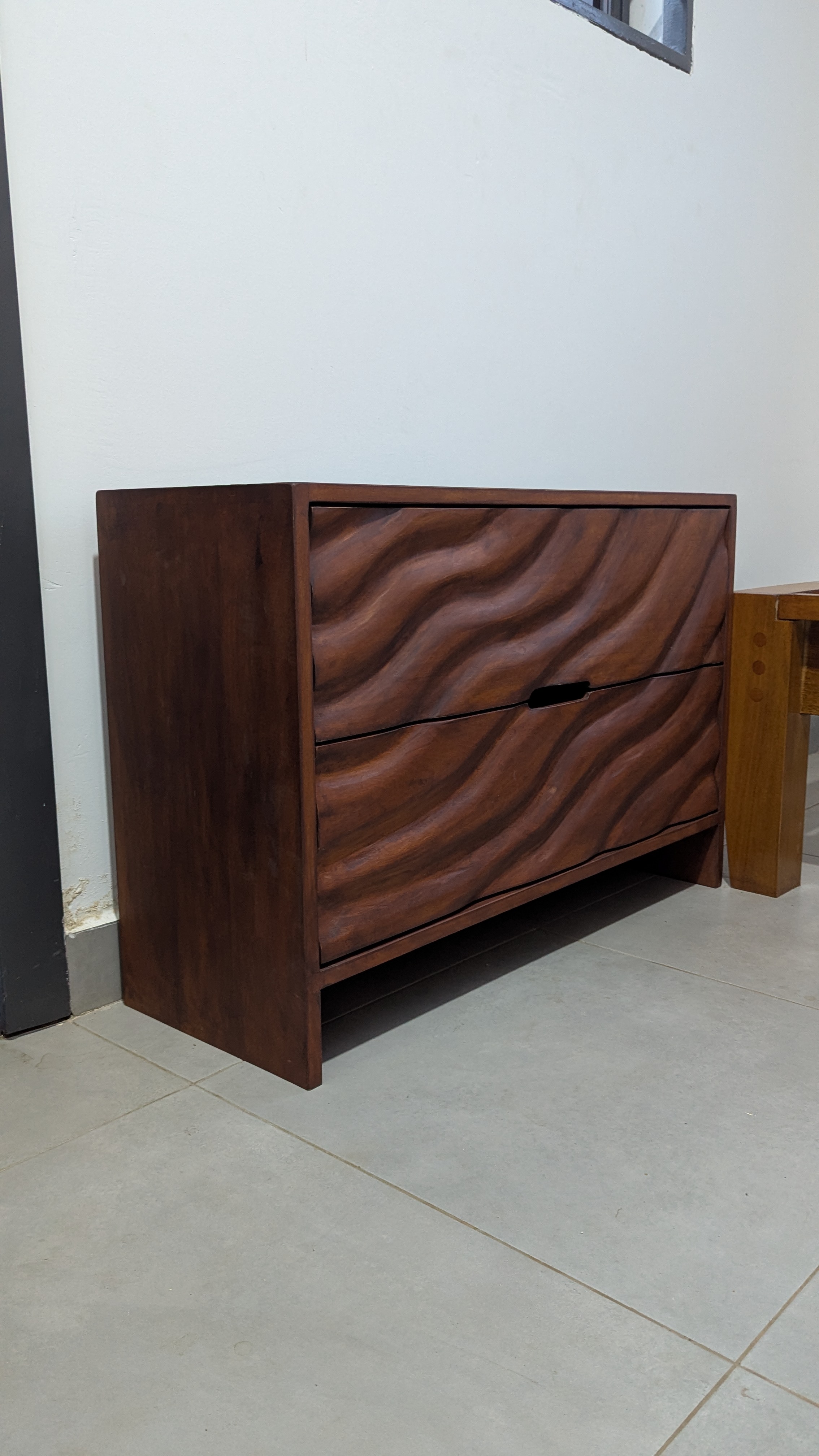 Wave-carved Guarea chest of drawers, Dome