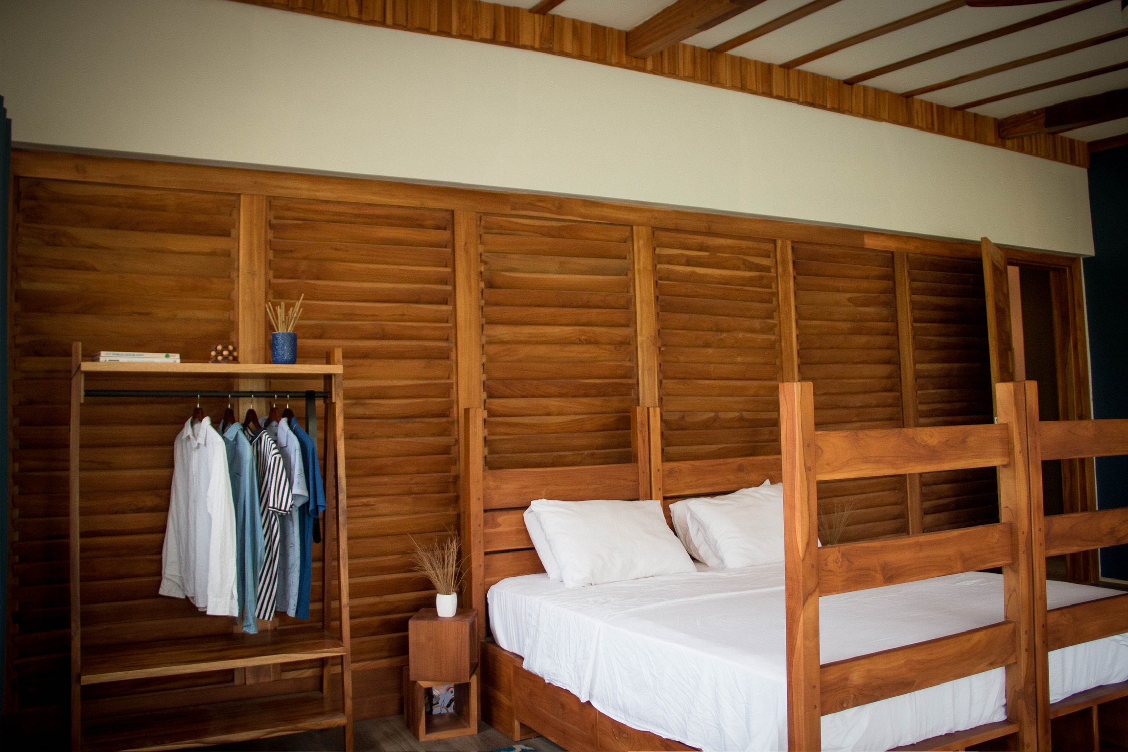 Detail of teak bed frame joinery and headboard construction at Sage Centre